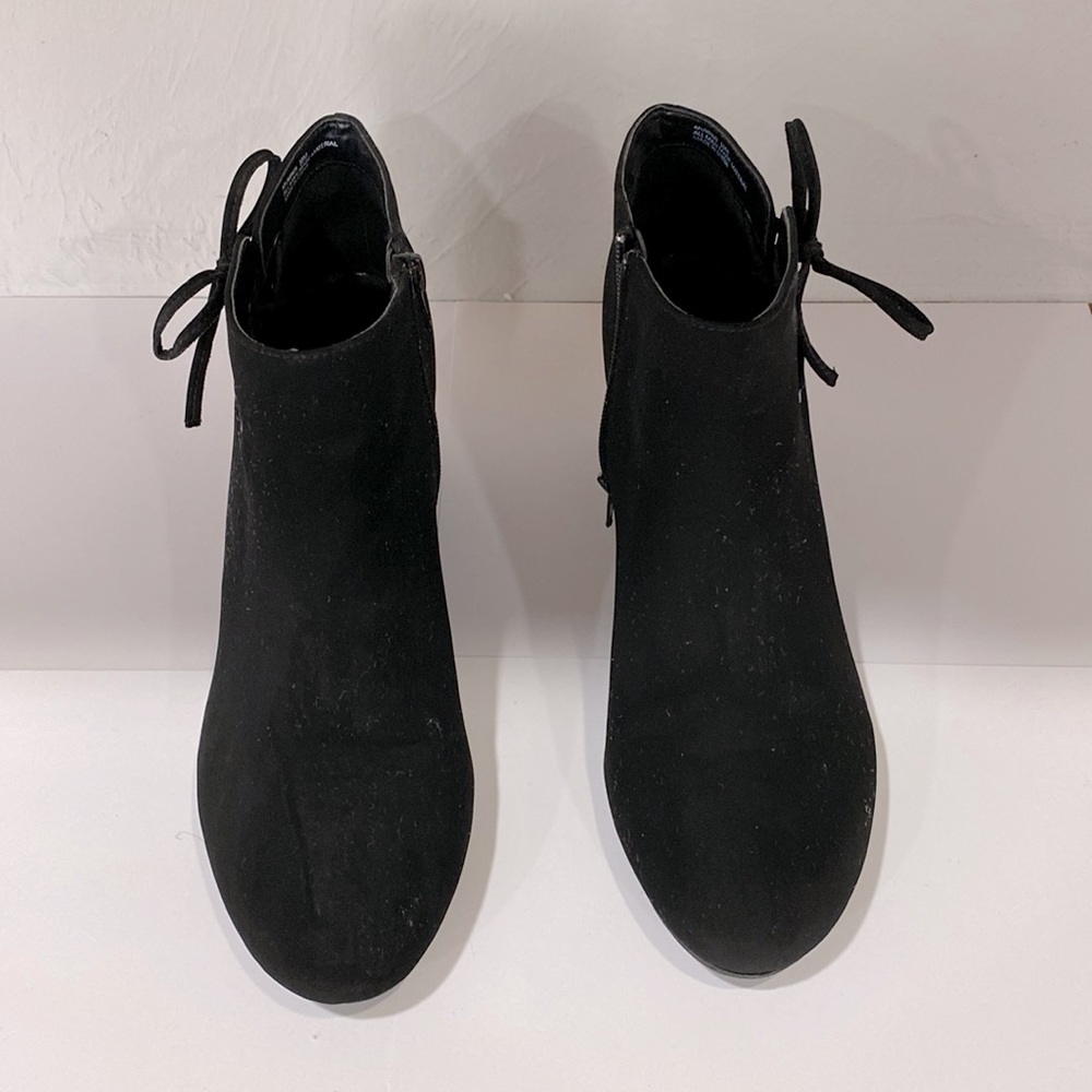 Black wedged boots with the tie on the side zip up on the inside